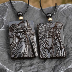 A pair of carved stone necklaces