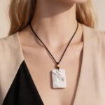 The Grey Servants Hand Carved White Agate Necklace