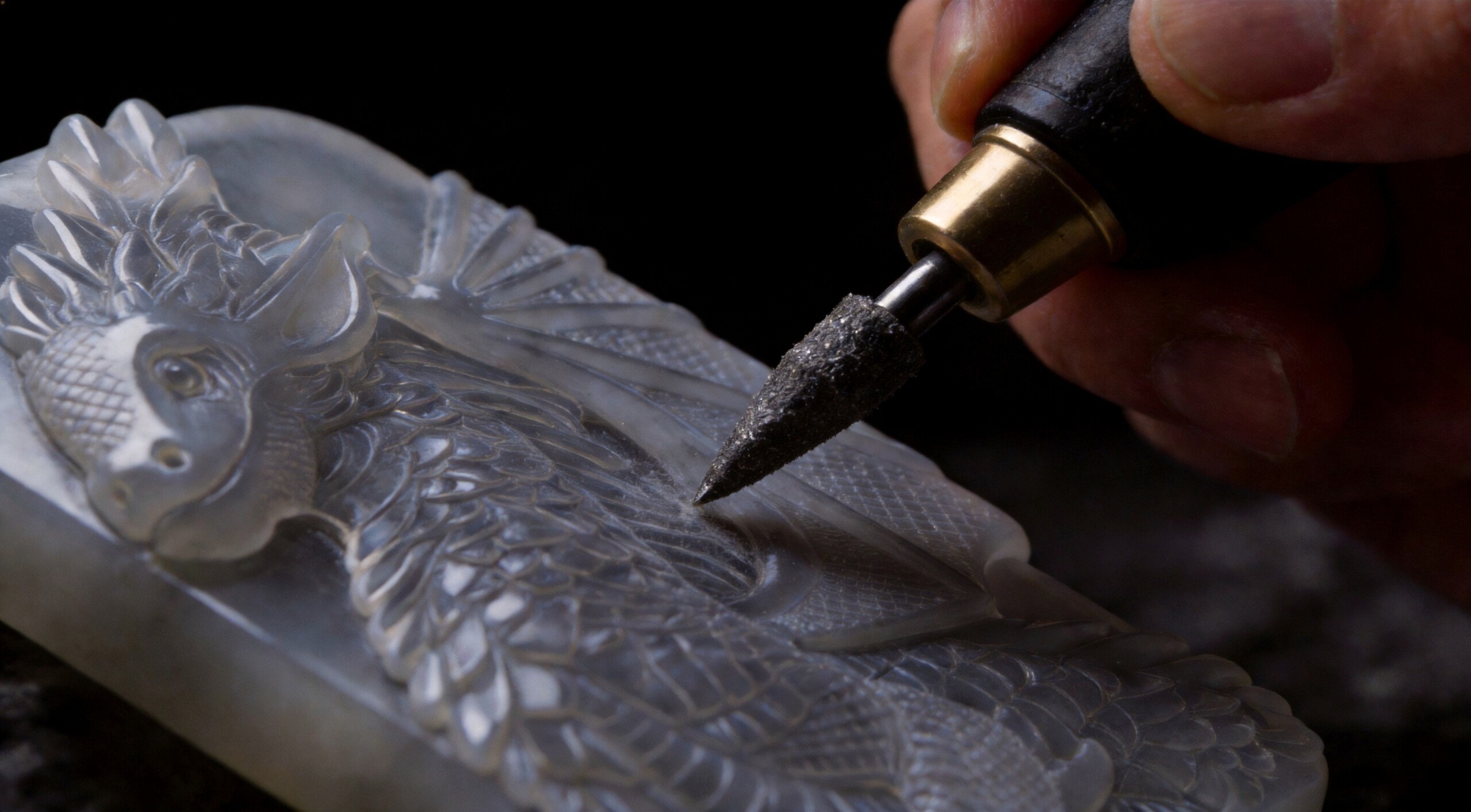Hand carving a white agate pendant with a rotary carving tool