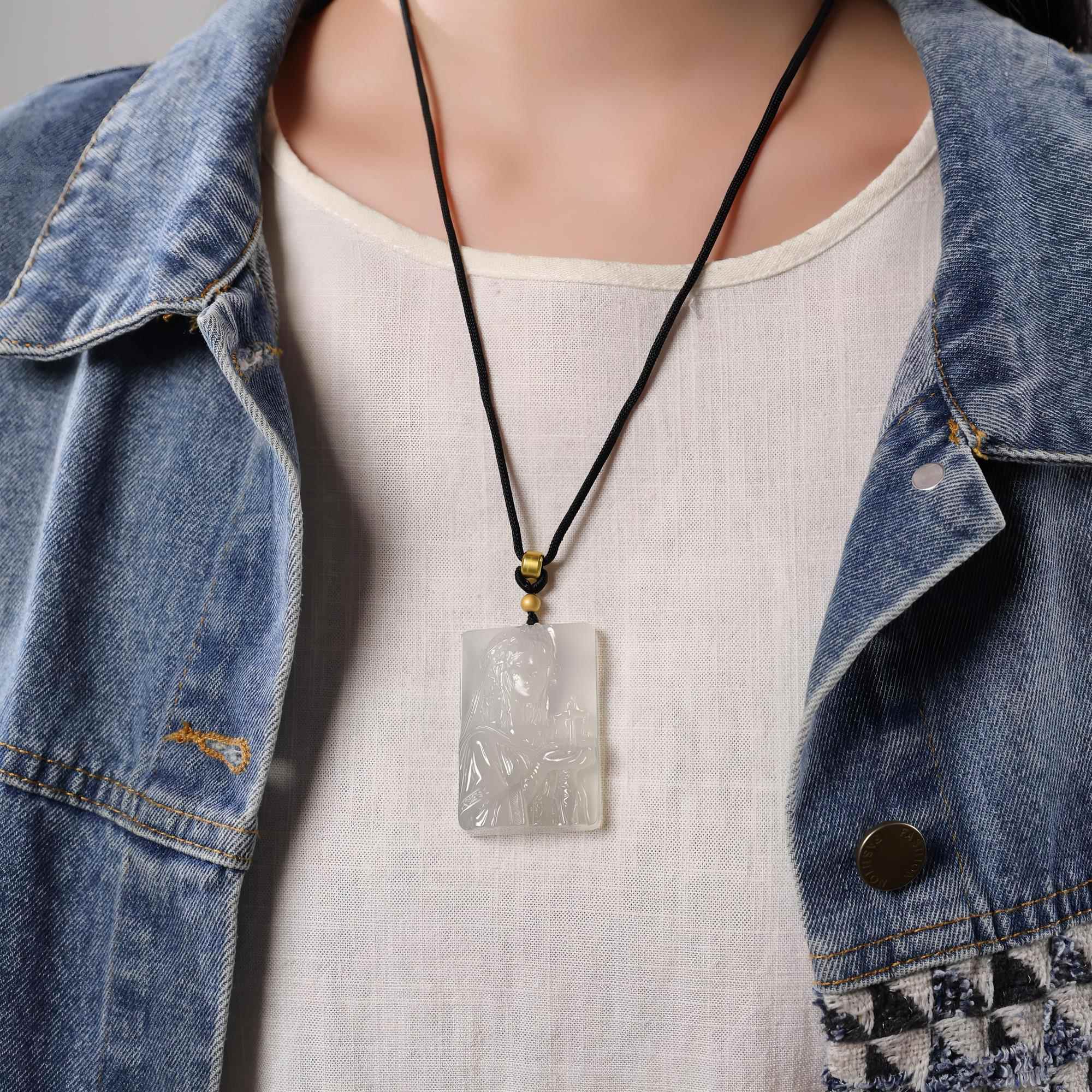 Libra white agate necklace worn on a black cord with a light shirt and denim jacket