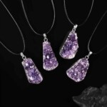 Four examples of raw amethyst necklaces; pendant shape selected at random