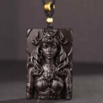 Scorpio black obsidian pendant standing upright with the carved portrait visible