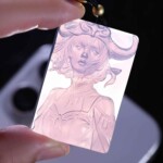 Taurus purple agate pendant held against light to show the carving